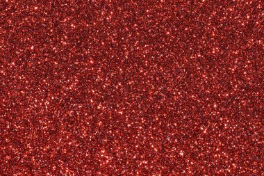 Parlak kırmızı noktalı kırmızı bir arkaplan. Arka plan kırmızının koyu tonudur, ve noktalar küçük ve parlaktır, hareket ve enerji hissi yaratır.