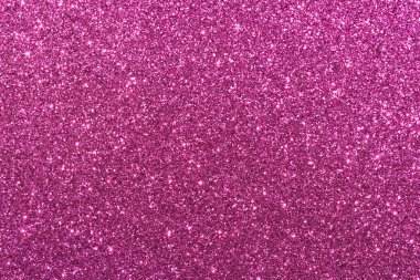 Pembe bir arka plan ve parlak bir doku. Parıltı tüm arka plana saçılmış.