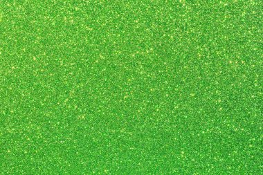 Işıltılı bir dokusu olan canlı yeşil bir arka plan. Yeşil renk cesur ve göz alıcı, parıltı ise sahneye biraz ışıltı ve cazibe katıyor.