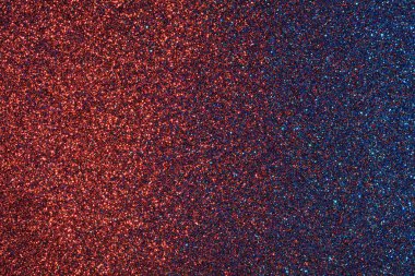 Mavi ve kırmızı bir arka plan ve bir sürü parıltı. Renkler parlak ve ışıltı tüm arka plana yayılmış.