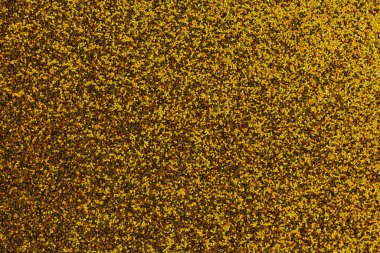 Bir sürü dokusu olan, altın ve siyah bir yüzeye yakın plan. Altın ve siyah renkler lüks ve bolluk hissi yaratır.