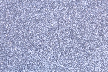 Birkaç küçük renk lekesi olan mavi ve gümüş renkli bir arka plan. Arka plan çok parlak ve yansıtıcı.