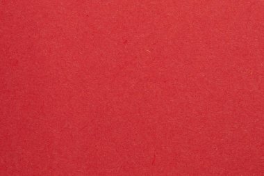 Ortasında beyaz bir nesne olan kırmızı bir arkaplan. Nesne, beyaz kenarlıklı, dokulu origami kağıt zeminli küçük bir kare.