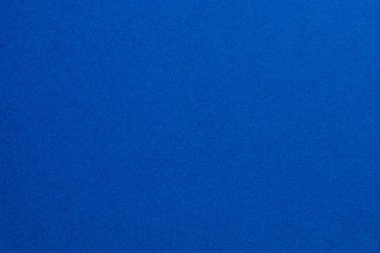 Beyaz noktaların etrafa saçıldığı mavi bir arka plan. Arkaplanın mavi rengi canlı, desenli origami kağıt arkaplanıdır