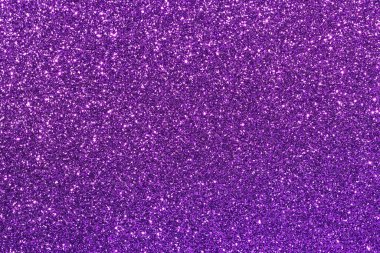 Pırıl pırıl mor noktalı mor bir arka plan. Arka plan koyu mor renktedir ve noktalar küçük, parlak ve mordur. Noktalar arka plana saçılmış.