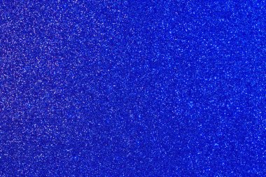 Bir sürü küçük mavi noktalı mavi bir arka plan. Görüntünün arka planda bir sürü küçük nokta var, derinlik ve doku hissi yaratıyor.