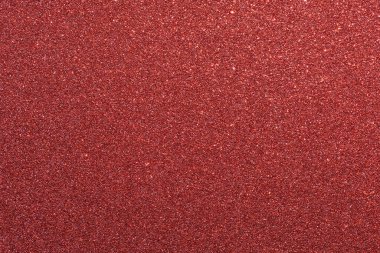 Kırmızı ve beyaz benekli bir halı. Halı bir sürü küçük kırmızı ve beyaz benekleri olan bir malzemeden yapılmıştır. Halı çok renkli ve çok desenli.