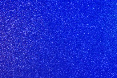 Bir sürü küçük noktalı mavi bir arkaplan.