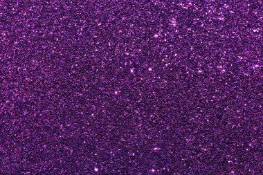 Pırıl pırıl mor bir arkaplan. Parıltı tüm arka plana saçılmış.