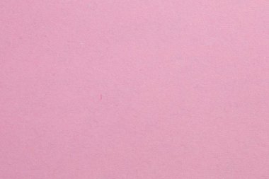 Ortasında beyaz bir nesne olan pembe bir arka plan. Nesne, beyaz kenarlıklı, dokulu origami kağıt zeminli küçük bir kare.