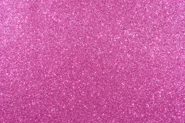 Pembe bir arka plan ve parlak bir doku. Arka plan pembe ve simler de pembe. Işıltı arka fonun her tarafına saçılmış. Parlak ve parlak bir görüntü veriyor.