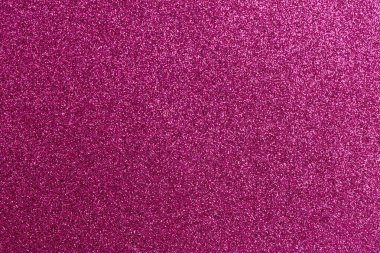 Pembe arka planda bir sürü parıltı var. Parıltı arka fonun her tarafına dağılmış, ışıl ışıl ve neşeli bir görünüm veriyor.