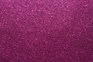 Mor parlak bir arka plan yakın plan. Arka plan küçük, parlak, renkli boncuklardan yapılmıştır.