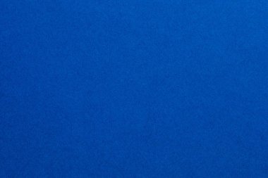 Beyaz noktaların etrafa saçıldığı mavi bir arka plan. Arkaplanın mavi rengi canlı, desenli origami kağıt arkaplanıdır