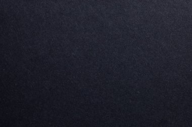 Ortasında beyaz nokta olan siyah bir arkaplan. Arkaplan koyu renkli ve beyaz nokta tek parlak nokta, dokulu origami kağıt zemin.