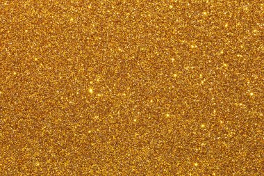 Parlak benekli altın bir arka plan. Altın arkaplan görüntünün odak noktasıdır.