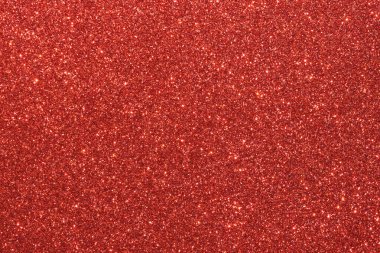 Parlak kırmızı noktalı kırmızı bir arka plan. Arka plan koyu kırmızı bir renktir, ve noktalar küçük ve parlaktır, parlak bir etki yaratır. İmajın şenlikli ve kutlama havası var.