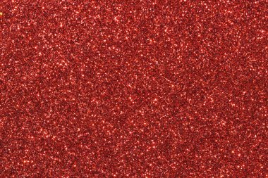 Parlak kırmızı noktalı kırmızı bir arka plan. Arka plan koyu kırmızı bir renktir, ve noktalar küçük ve parlaktır, parlak bir etki yaratır. İmajın şenlikli ve kutlama havası var.