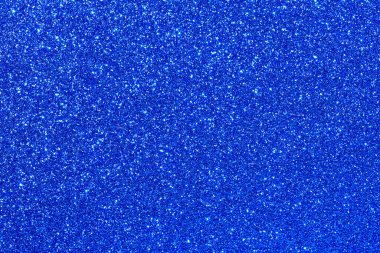 Parıltılı mavi bir arka plan. Parıltı mavi ve ışığı yansıtıyor gibi görünüyor.