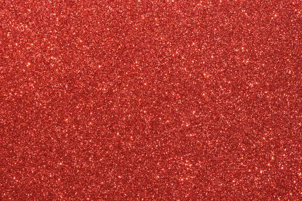 Parlak kırmızı noktalı kırmızı bir arka plan. Arka plan koyu kırmızı bir renktir, ve noktalar küçük ve parlaktır, parlak bir etki yaratır. İmajın şenlikli ve kutlama havası var.