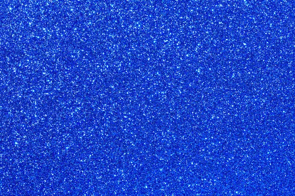 Parıltılı mavi bir arka plan. Parıltı mavi ve ışığı yansıtıyor gibi görünüyor.