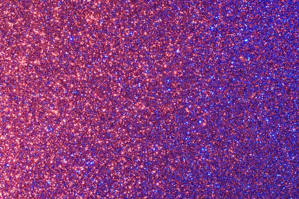 Ortasında kırmızı ve mavi nokta olan mor ve mavi bir arka plan. Arka plan ışıltılı ve nokta küçük ve parlak.