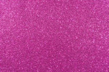 Pembe bir arka plan ve parlak bir doku. Arka plan pembe ve simler her yere saçılmış.