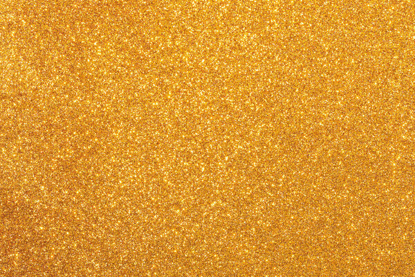 Золотой фон с множеством блесток. Блёстки разбросаны и фон очень блестит.