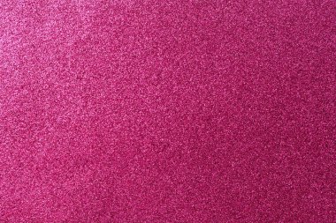 Pembe bir arka plan ve bir sürü parıltı. Parıltı tüm arka plana saçılmış.