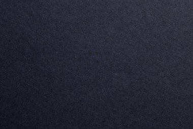 Ortasında beyaz nokta olan siyah bir arkaplan. Arkaplan çok karanlık ve beyaz nokta tek ışık kaynağı, dokulu origami kağıt fon.