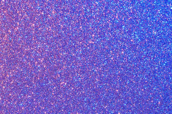 Parıltılı mavi ve mor bir arka plan. Parıltı tüm arka plana saçılmış.