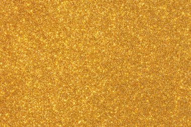 Parlak benekli altın bir arka plan. Altın arkaplan görüntünün odak noktasıdır.