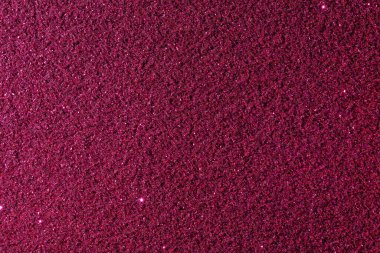 Kırmızı arkaplanda bir sürü küçük nokta var. Arka plan koyu kırmızı renkte ve noktalar resmin her tarafına dağılmış. Görüntüde canlı ve enerjik bir his var.