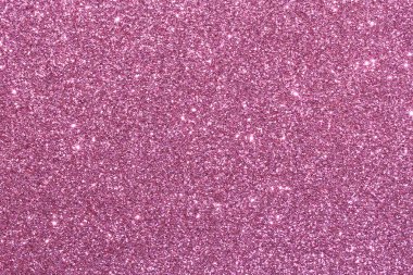 Pembe bir arka plan ve parlak pembe noktalar. Arka plan pembenin koyu tonu ve noktalar pembenin açık tonu. Noktalar arka plana saçılmış.