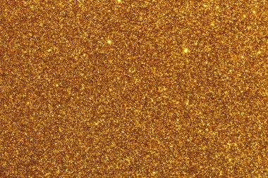 Işıltılı desenli altın bir arka plan. Altın rengi parlak ve parlak, ve parıltı görüntüye bir hareket ve derinlik hissi katıyor. Manzara lüks ve göz kamaştırıcı.