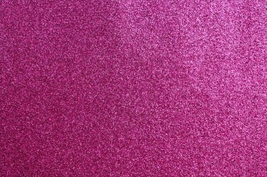 Pembe arka planda, etrafa saçılmış küçük beyaz noktalar. Arkaplan pembenin canlı bir tonudur, noktalar ise zıt beyaz renktedir. Görüntü çok neşeli.