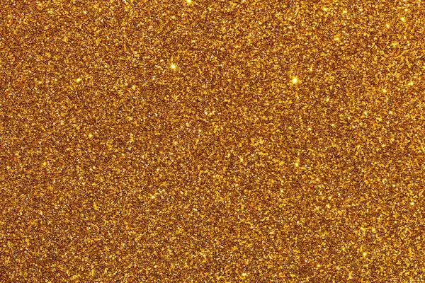 Işıltılı desenli altın bir arka plan. Altın rengi parlak ve parlak, ve parıltı görüntüye bir hareket ve derinlik hissi katıyor. Manzara lüks ve göz kamaştırıcı.