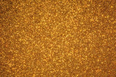 Parlak benekli altın bir arka plan. Altın arkaplan görüntünün odak noktasıdır.