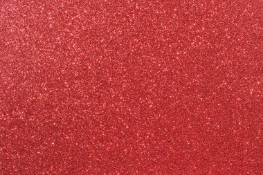 Parıltılı kırmızı bir arka plan. Arka plan çok parlak ve ışıltılı.