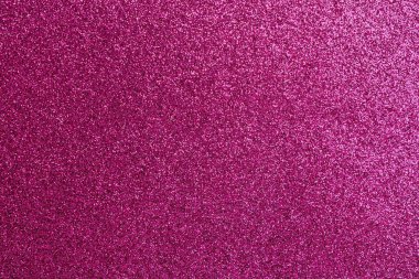 Bir sürü küçük beyaz noktalı pembe bir arka plan. Arkaplan pembenin canlı bir tonudur, noktalar ise küçük ve görüntünün dört bir yanına dağılmıştır. Genel efekt çok eğlenceli.