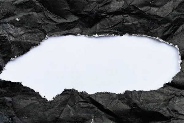 Siyah, buruşuk bir tuvalde beyaz bir delik. Tasarım için boş, tasarımcı için grafik kaynağı
