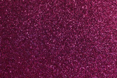 Mor parlak bir arka plan yakın plan. Arka plan küçük, parlak, renkli sim parçalarından oluşuyor.