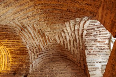 Intricate brick vault ceiling of an ancient historical building.
