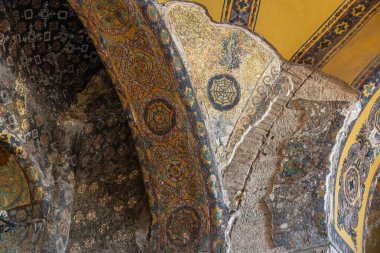 Intricate byzantine mosaics in historic architectural arch.