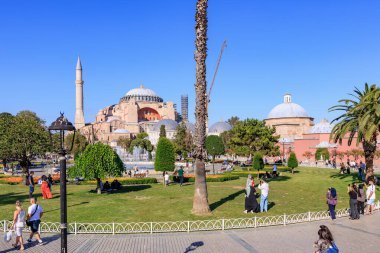 Sunny day at hagia sophia with tourists and lush gardens in istanbul. August 12, 2025 Istanbul Turkey.