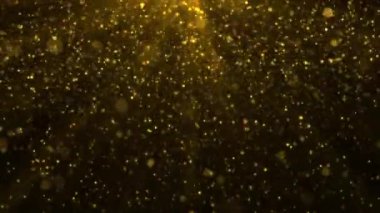Parlak altın parçacıkları ve parıldayan ışık ışınlarıyla soyut arka plan animasyonu. Bu pırıl pırıl altın renkli arka plan animasyonu tam bir HD ve kusursuz bir döngüdür..
