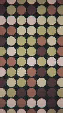 Dikey video - kahverengi, bej ve yeşil renkli yanıp sönen dairelerle 1970 'lerin modası geçmiş geometrik arka planı. Bu tarz hareketli arka plan animasyonu HD ve pürüzsüz bir döngüdür.