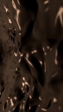 Dikey video - koyu, ipeksi erimiş çikolata hareketli lezzetli bir akış arka plan animasyonu.