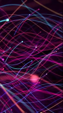 Dikey video - canlı çok renkli parlayan, akıcı renkli parçacıklar ve hareket izleri. HD ve döngü soyut hareket arkaplan canlandırması.