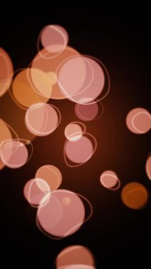 Dikey video - kahverengi, turuncu ve bej küreler ve halka karalamalarıyla soyut retro bokeh arkaplan. Bu klasik tarz hareket arkaplan animasyonu tam HD ve dikişsiz bir döngüdür.